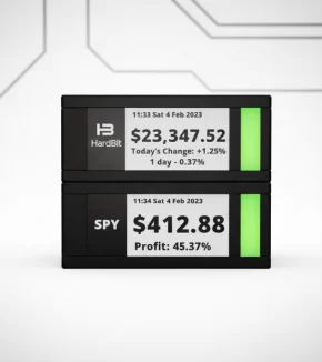 TickrMeter E-Ink display showing live Bitcoin and stock market prices on a minimalist desk