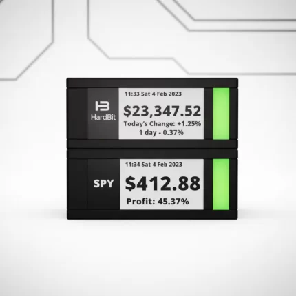 TickrMeter E-Ink display showing live Bitcoin and stock market prices on a minimalist desk